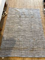 Full view of woven cotton throw rug