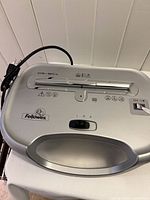 Top view showing Fellowes logo, model marking and control switch