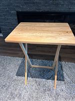 Single TV tray unfolded displaying top and leg structure