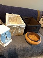Group: scale, two wicker baskets, espresso basket, wood bowl