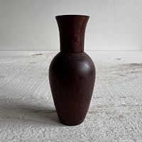 Full view of wooden bottle standing upright