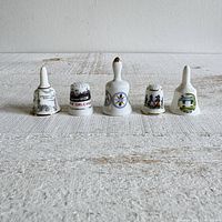 Front view of all five porcelain miniatures lined up