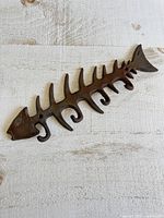 Full view of cast iron fish skeleton wall hook rack