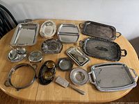 Overall view of all silver tone serveware on table