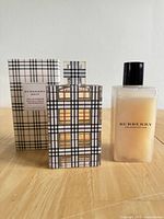 Front view of Burberry Brit perfume bottle with box and shower gel