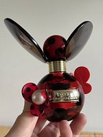 Front view of Marc Jacobs Dot perfume bottle showing label and decorative elements