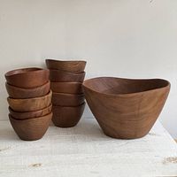 Large bowl beside stack of small bowls to show full set