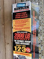 Front of Loadhandler box showing product name, 2000-lb capacity, warranty and branding