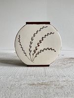 Front view showing pussy willow design and overall shape