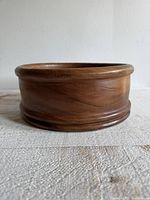 Side view of acacia wood bowl showing grain and shape