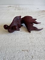 Left side view of rosewood koi goldfish showing scales, fins and pop eyes