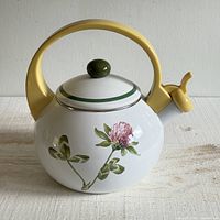 Right side view showing pink clover graphic, yellow handle, green knob