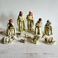 Full group view of all eleven nativity pieces