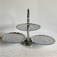 Stand fully extended showing three filigree plates