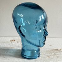 Front left view of blue-tinted glass head