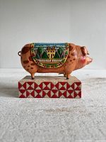 Left side view showing painted scene and base