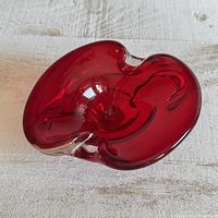 Top view showing red glass freeform ashtray