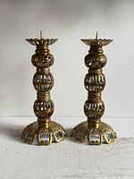 Pair of brass pierced candlesticks full view