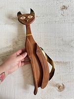 Full view of wood and metal cat wall hanging