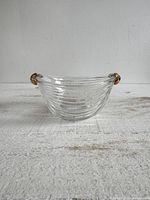 Front view of clear ribbed crystal bowl showing gold painted handles