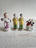 All four figurines front view