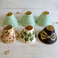 Six paper lamp shades showing all designs