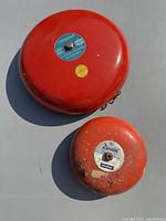 Large and small red alarm bells front view
