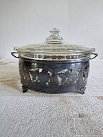 Casserole with lid in stand, front view