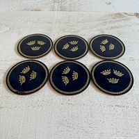 six coasters laid out top view showing design