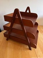 Side view showing A-frame structure and three tiers