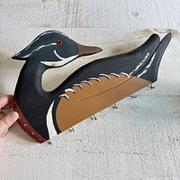 Front view of painted wood duck key holder showing full silhouette and hooks