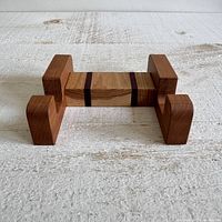Top view of hardwood cutting board stand showing slot and wood pattern