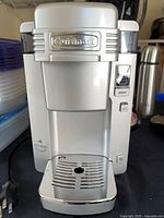 Front view of Cuisinart SS-300 brewer showing drip tray and logo