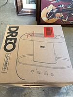Top view of sealed Dreo humidifier box with product illustration and branding