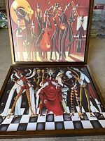 Both framed canvases showing jazz band and dancers