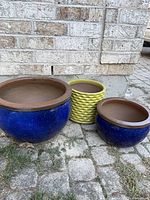 Group shot of three ceramic garden pots