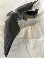 Full view of carved birds and stone base