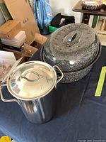 Enamel roasting pan and stainless asparagus pot side by side