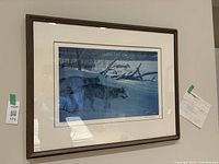 Framed Robert Bateman limited edition print showing wolves in snow