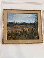 Front view of framed landscape oil painting