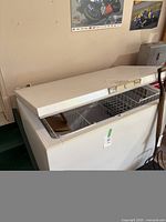 Overall view of Woods chest freezer with lid open