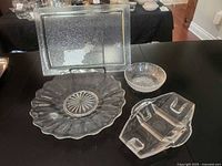 All four glass pieces displayed on table