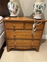 Front view of Durham wood nightstand with four drawers