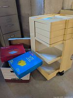 Storage caddy and partial Staples boxes in front