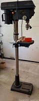 Full view of standing 12" Mastercraft drill press showing base, column, table and head