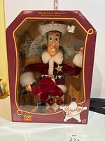 Front view of boxed Holiday Hero Woody doll