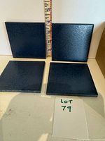 Four of the dark blue 4x4 tiles displayed with ruler for scale and lot card visible