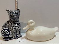front view of pottery cat and ceramic duck