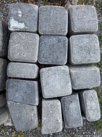 Top view of stacked square grey concrete pavers