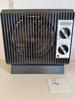 Front view of Seabreeze space heater showing control knobs and grill